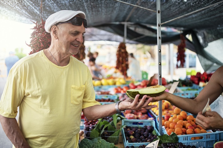 Older Gentleman at Purchasing Produce at Farmer's Market