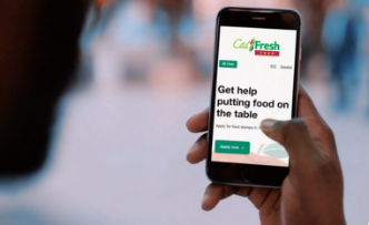 a phone with the GetCalFresh.org web